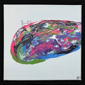 En mand går tur med sin hund blandt farver og former.